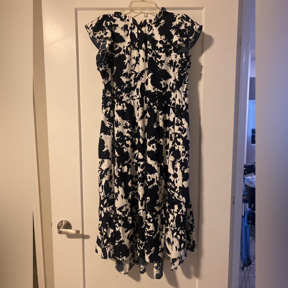 Navy blue and white pattern midi dress with a ruffle sleeve! Only worn once.